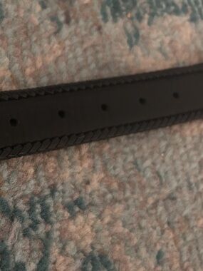 Classic Black women’s Belt with Braided Edge and a western type of hardware 

I